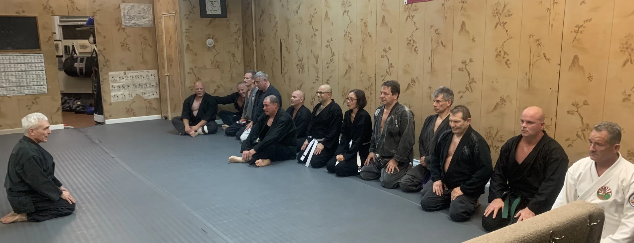 An adult class seated in seiza at Zen Goju Temple.