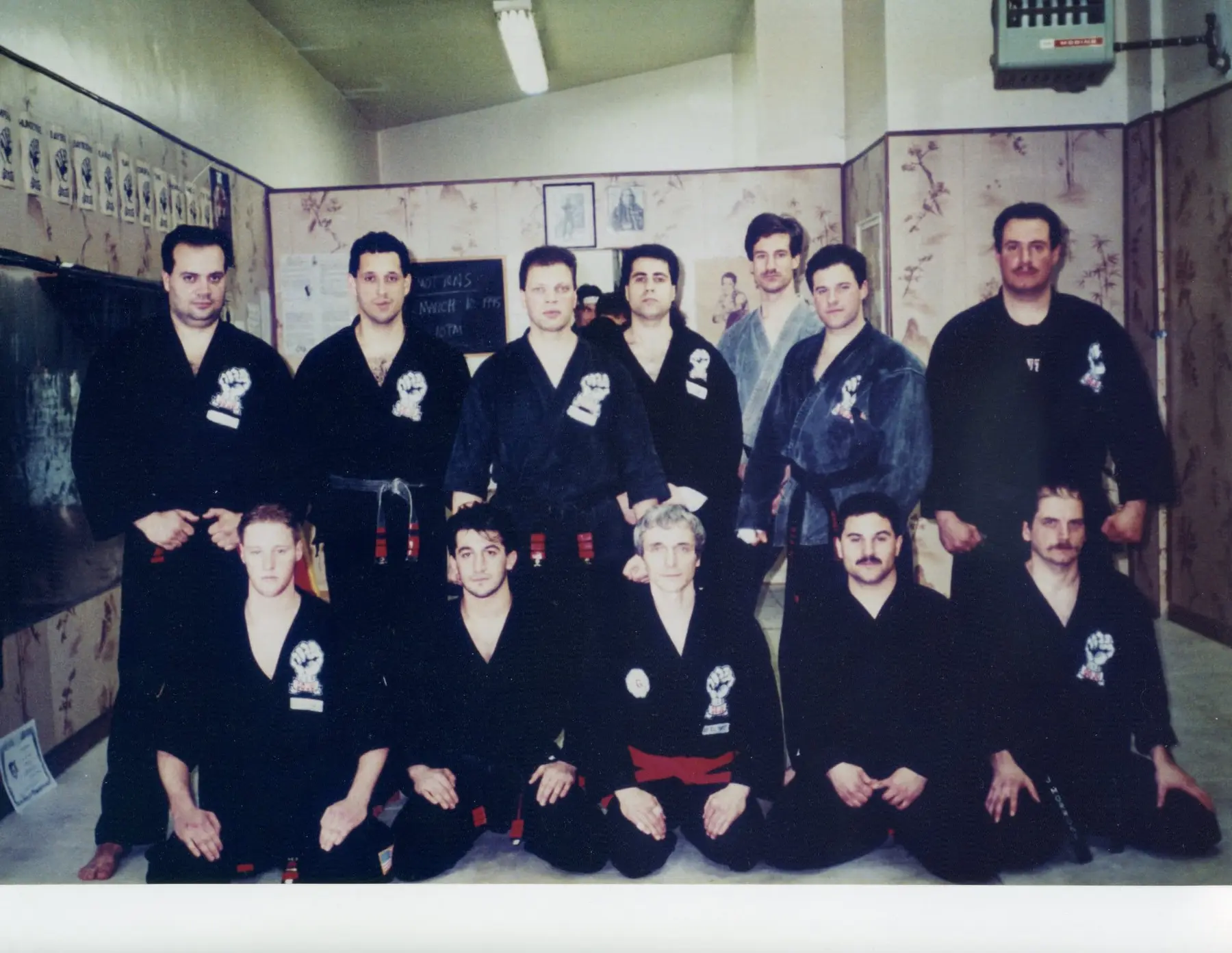 Black belts of Zen Goju Temple lined up on the dojo mat.